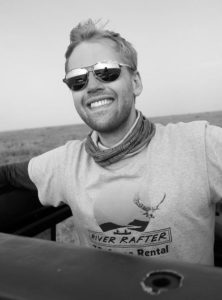 image of man taking great photo while on African safari for Wildlife photo book